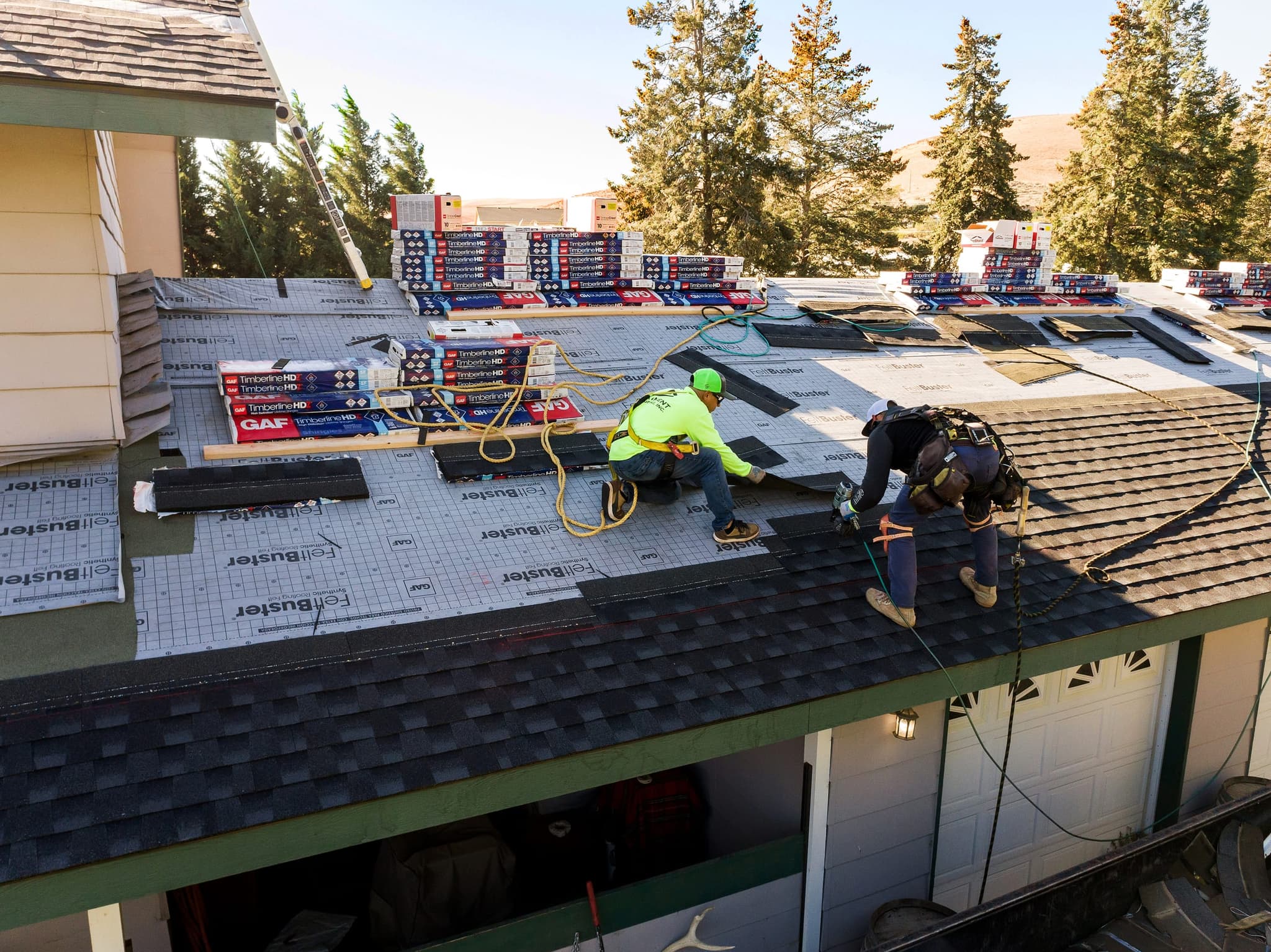 Eminent Roofing crew working on a Tri-Cities residential roof