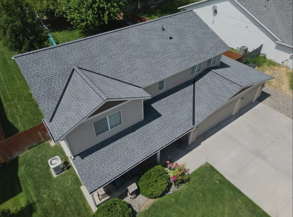 Front aerial of a multi-gable Pewter Gray roof in West Richland
