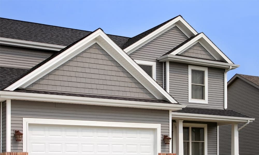 Gray lap and shake siding with white fascia and trim on a Tri-Cities home