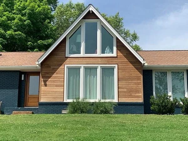 Natural wood siding on a gable-end home
